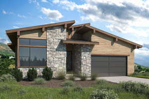 Modern home featuring stone siding, driveway, and an attached garage