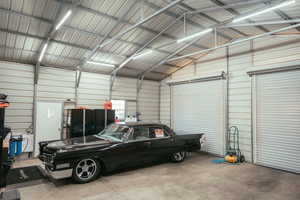 Garage featuring metal wall