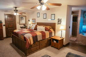 Bedroom featuring ceiling fan and light colored carpet
