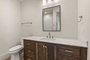 Bathroom with toilet and vanity