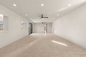 Carpeted empty room with recessed lighting and ceiling fan