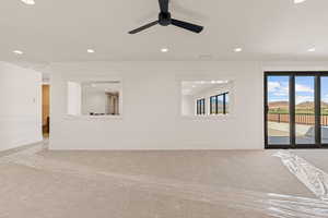 Carpeted empty room with recessed lighting and ceiling fan