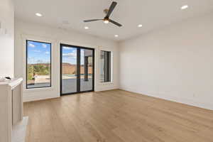 Spare room with light wood-type flooring, recessed lighting, and a ceiling fan