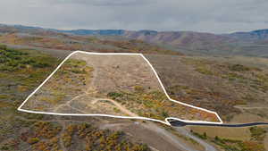 View of rural area with property boundaries highlighted and mountains