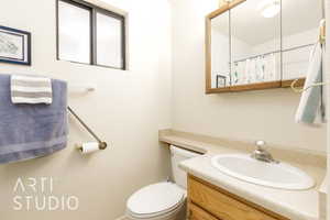 Bathroom featuring vanity and toilet