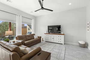 Living area featuring ceiling fan, recessed lighting, and light wood finished floors