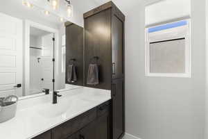 Bathroom featuring vanity and tub / shower combination