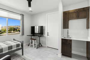 Bedroom with ceiling fan and recessed lighting