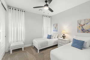 Bedroom with carpet and ceiling fan