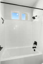 Full bath featuring bathtub / shower combination