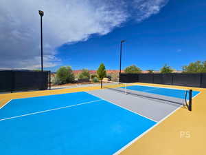 View of tennis court with community basketball court