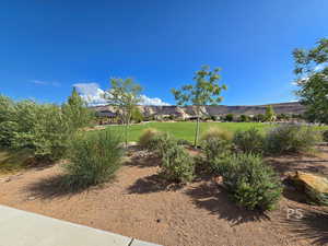 View of green lawn featuring a gazebo and a mountain view