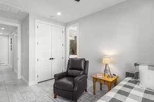 Bedroom featuring recessed lighting, ensuite bathroom, and a closet