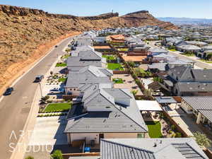 Aerial perspective of suburban area featuring a mountainous background