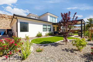 Back of house featuring a patio and stucco siding