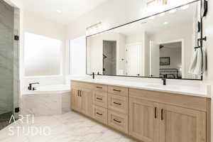 Full bathroom with a marble finish shower, a garden tub, double vanity, light marble finish flooring, and a ceiling fan