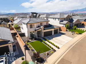 View of front facade with a residential view, driveway, and a mountain view