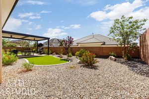 Fenced backyard featuring a patio