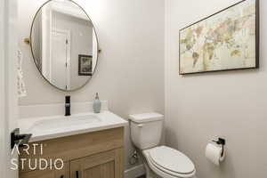 Half bath with vanity and toilet