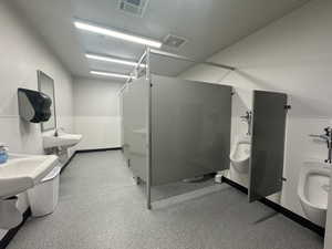 Full bath featuring a bidet and a stall shower