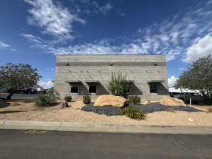 View of property exterior featuring brick siding