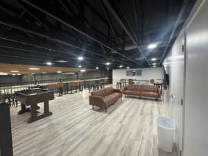 Game room with light wood finished floors