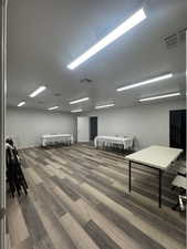 Office featuring dark wood finished floors and baseboards