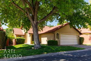 Mediterranean / spanish-style house featuring a tile roof, stucco siding, driveway, and a garage