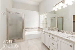 Bathroom featuring double vanity, a bath, a shower stall, and light tile patterned floors
