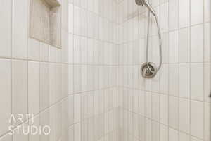 Bathroom view of a tile shower