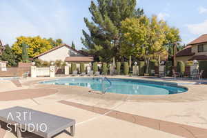 Community pool featuring a patio area