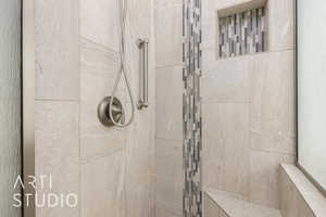 Full bath with tiled shower