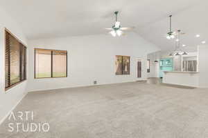 Unfurnished living room featuring light carpet, a ceiling fan, and high vaulted ceiling
