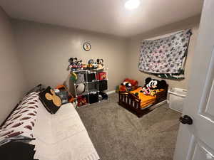 Rec room with carpet and baseboards