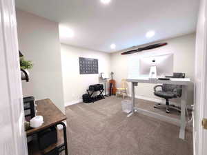 Home office with carpet flooring and recessed lighting