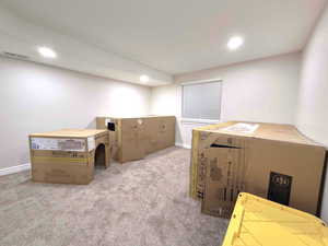 Basement with carpet flooring and recessed lighting