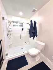 New double head shower,  cultured marble walls, and wood finished floors