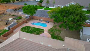 View of pool with a patio and a fenced backyard