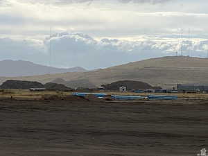 View of mountain background featuring rural landscape