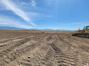 View of mountain backdrop featuring rural landscape