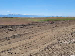 View of mountain backdrop featuring rural landscape