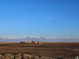 View of mountain backdrop with rural landscape