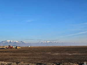 View of mountain backdrop with rural landscape