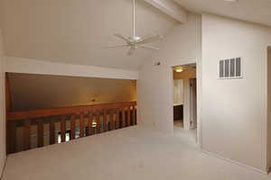 Bonus room with beamed ceiling, high vaulted ceiling, ceiling fan, and carpet flooring
