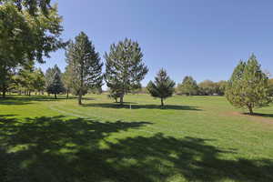 View of home's community with a yard