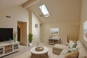 Virtual staged loft area featuring a skylight, high vaulted ceiling, carpet flooring, a ceiling fan, and beamed ceiling