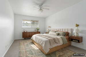 Bedroom with carpet floors, brick wall, and ceiling fan