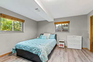 Bedroom with light wood-type flooring