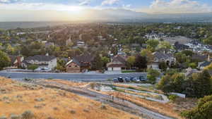Aerial perspective of suburban area with a mountainous background