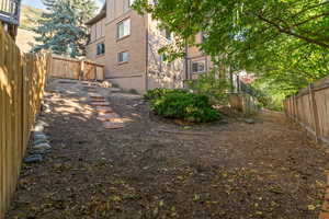 View of fenced backyard